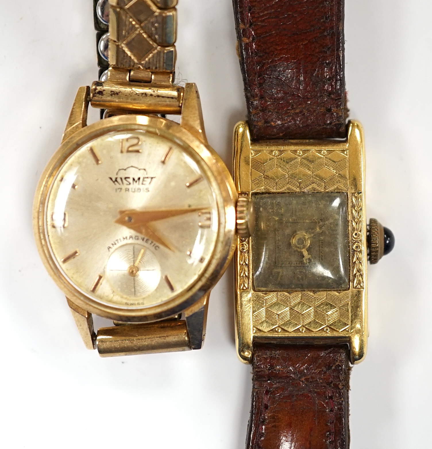 Two 18k cased lady's manual wind wrist watches, including Kismet, on gold plated or leather bracelets.